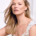 Kate Moss poses nude except for fake fur in stunning cavewoman