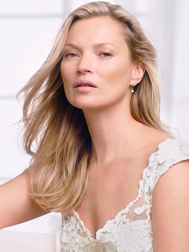 Kate Moss poses nude except for fake fur in stunning cavewoman